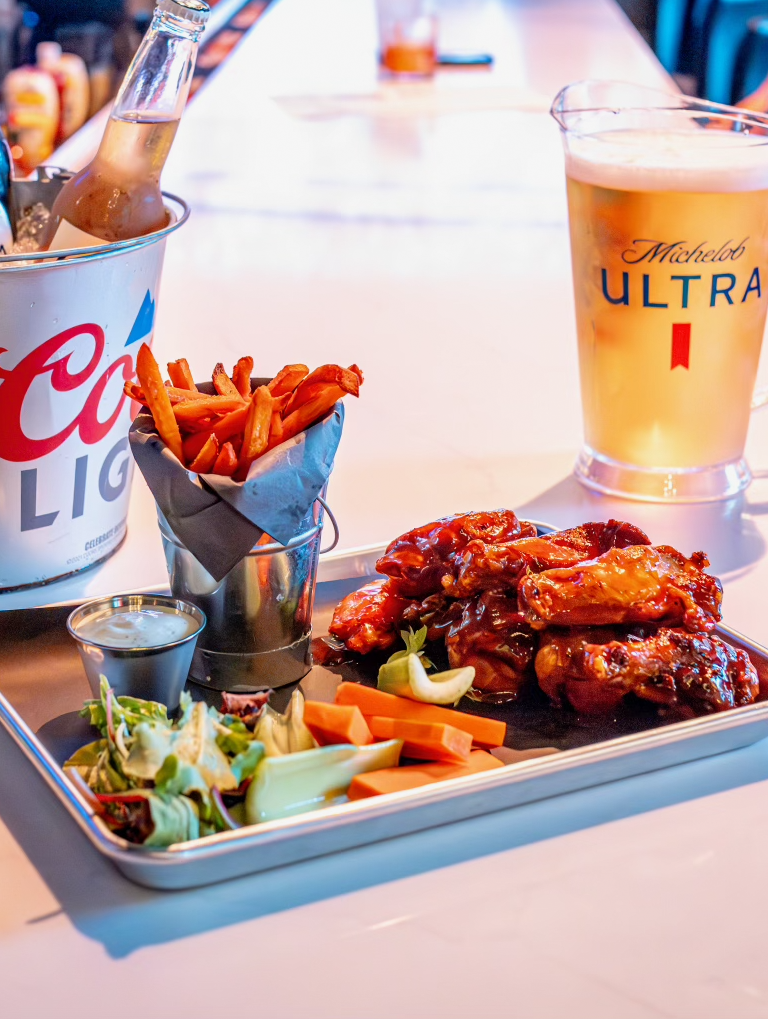 Wings, Beer, and Fries on the bar at Ramblers Sports Bar & Grill in Birmingham, Alabama